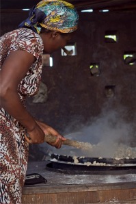 Alice from Pader stirring lunch for hundreds of girls
