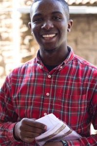 Moses, Joy's cousin selling handkerchiefs.