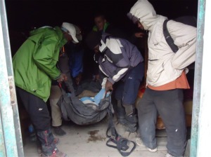 Pete being walked down Mt Kilimanjaro with a broken leg.