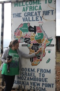 Liz at the Equator sign