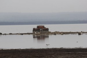 The lake is so flooded that a road sign is now under water